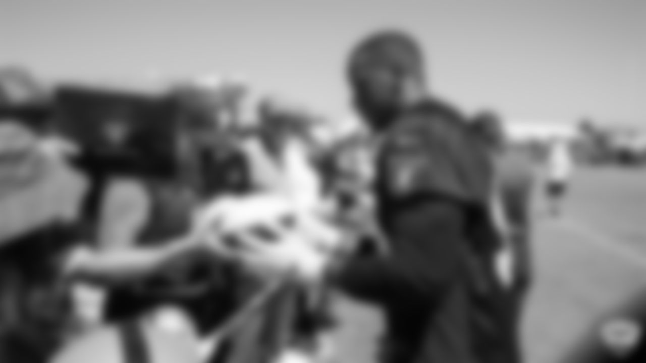 Oakland Raiders defensive end Clelin Ferrell (96) signs autographs for fans after practice at 2019 Training Camp.