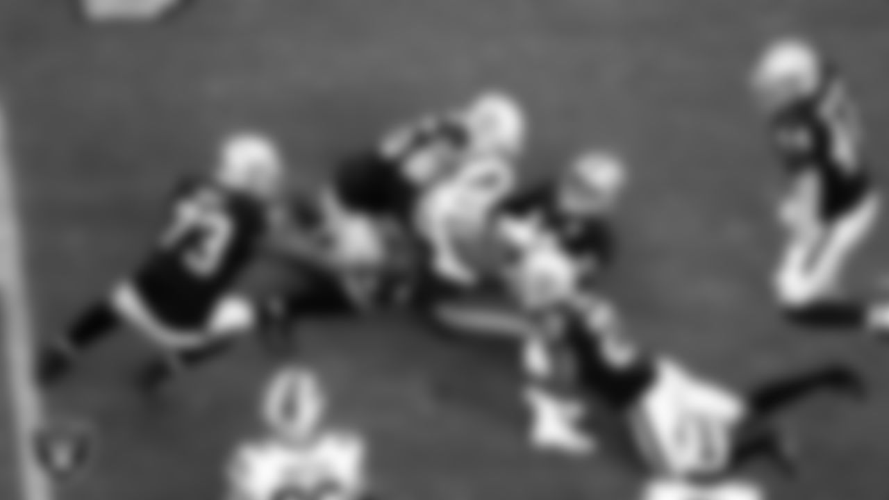 Las Vegas Raiders defensive tackle Maurice Hurst (73), safety Erik Harris (25), safety Johnathan Abram (24) and cornerback Trayvon Mullen (27) make a tackle during the regular season home game against the Buffalo Bills.