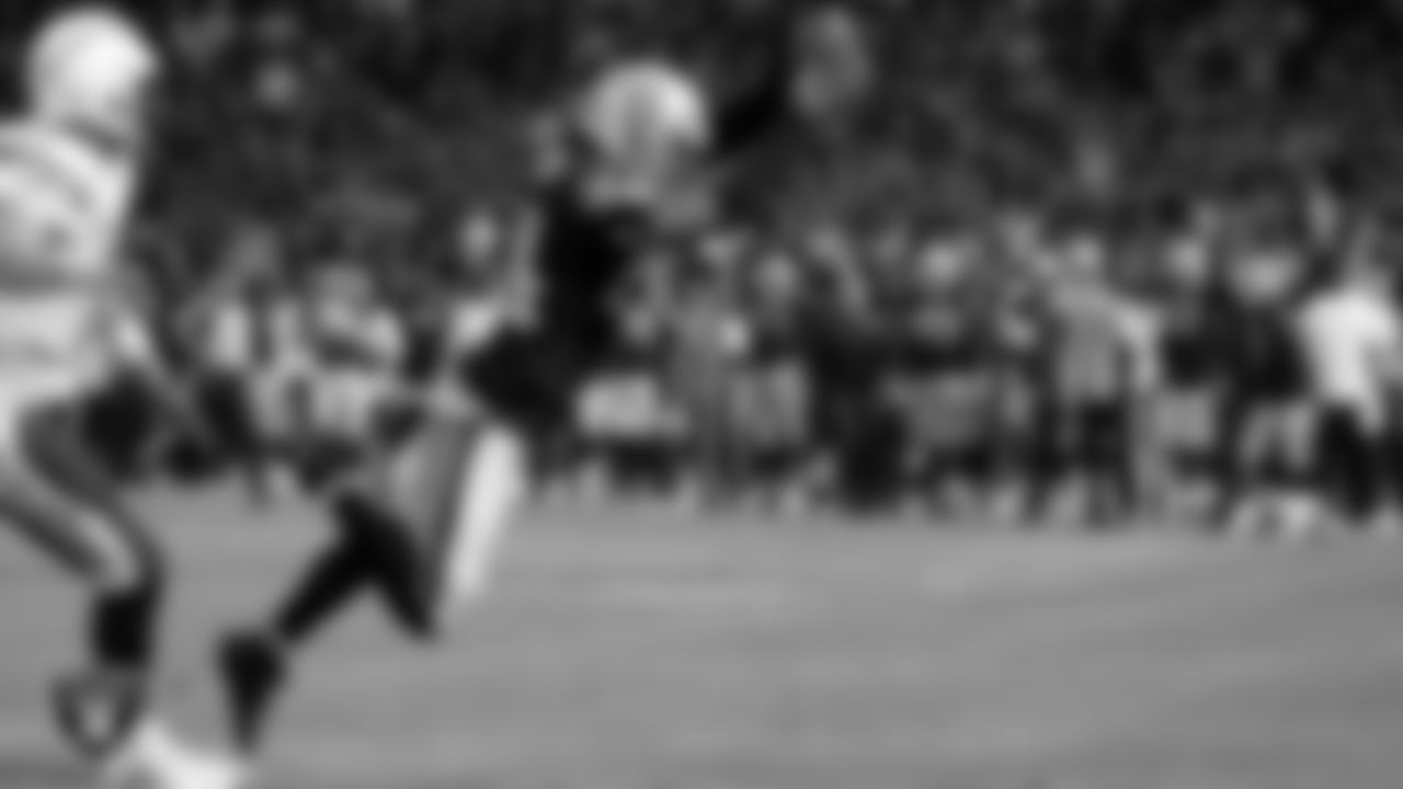 Raiders cornerback Charles Woodson (24) dives into the end zone for a touchdown on a 25-yard fumble recovery during the regular season home game against the San Diego Chargers.