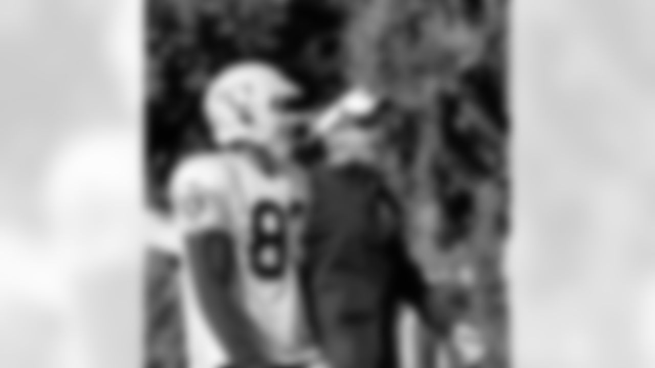 WR Isaiah Willaims walking with Head Coach Dennis Allen