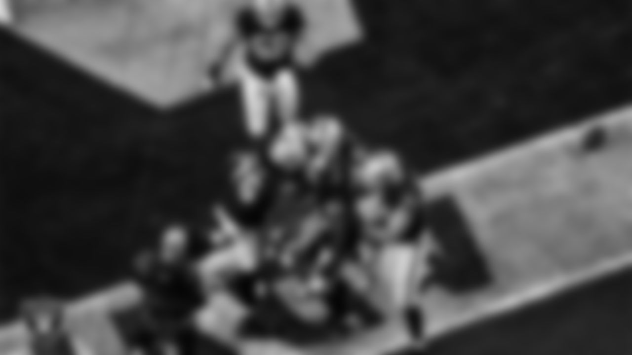 Las Vegas Raiders running back Josh Jacobs (28) is congratulated by teammates after rushing for a 1-yard touchdown during the regular season home game against the Los Angeles Chargers.
