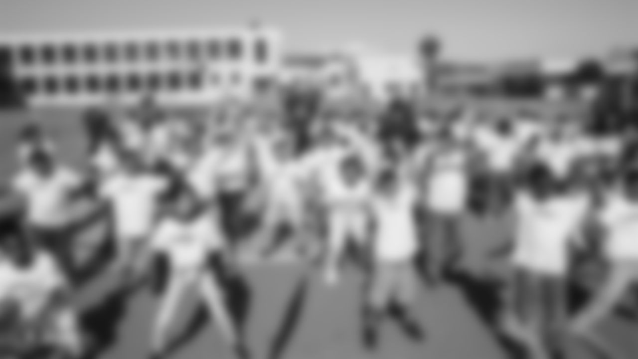The Oakland Raiders, represented by players Alec Ingold, Isaiah Johnson, Trent Sieg, Darren Waller, and Kyle Wilber, along with the Raiderettes, collaborate with Playworks to promote Play 60's message to students of being active for sixty minutes everyday.