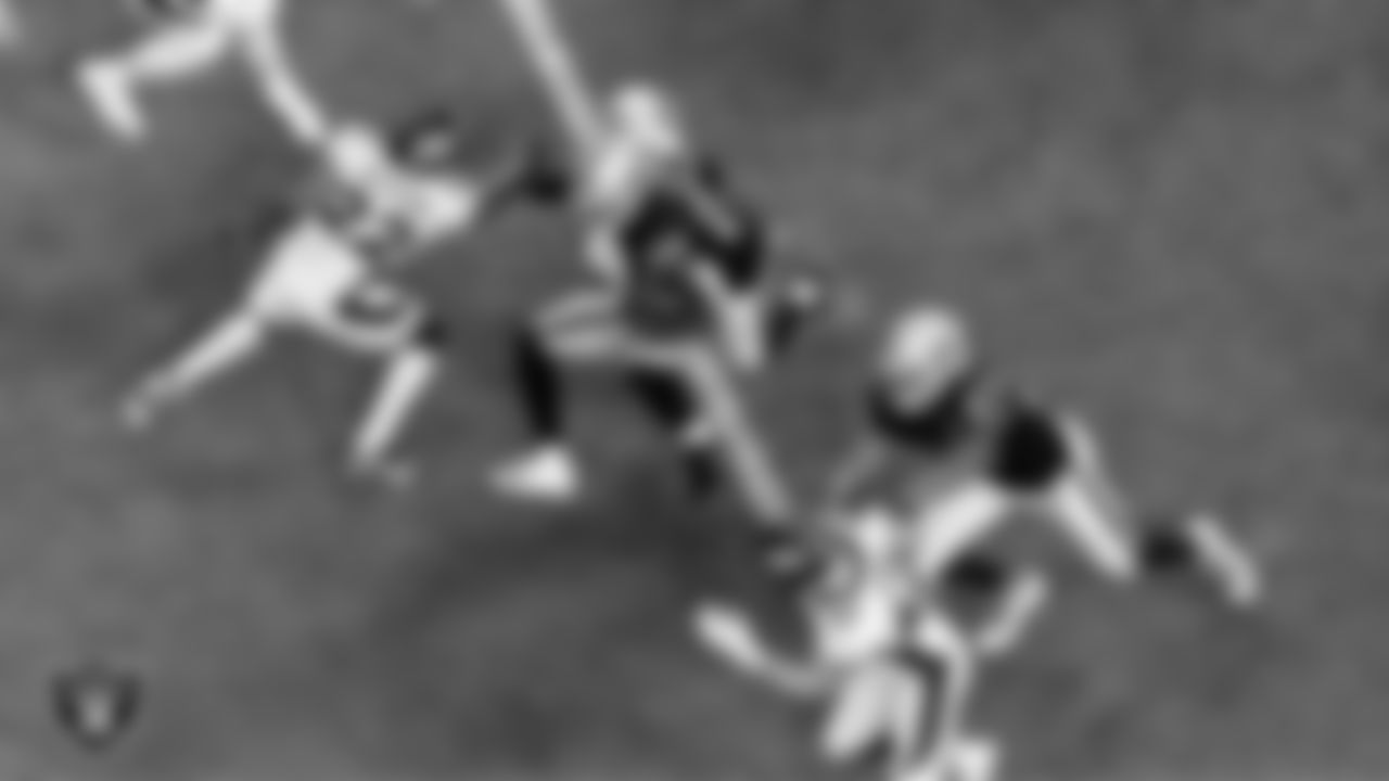 Las Vegas Raiders running back Josh Jacobs (28) rushes as wide receiver Henry Ruggs III (11) and tight end Darren Waller (83) block during the regular season home game against the Denver Broncos.
