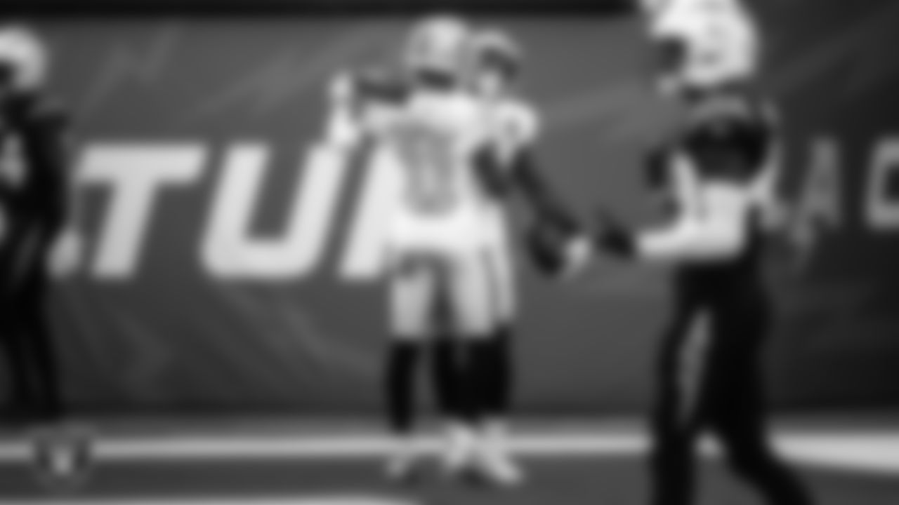 Las Vegas Raiders wide receiver Nelson Agholor (15) celebrates with wide receiver Henry Ruggs III (11) after making a 45-yard touchdown catch during the regular season away game against the Los Angeles Chargers.