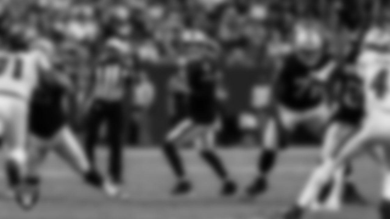 Las Vegas Raiders quarterback Derek Carr (4) looks for a receiver during the regular season home game against the Baltimore Ravens.
