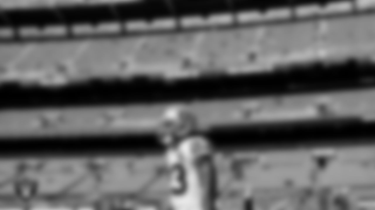 The Raiders warm up before the regular season game against the Cleveland Browns at FirstEnergy Stadium.