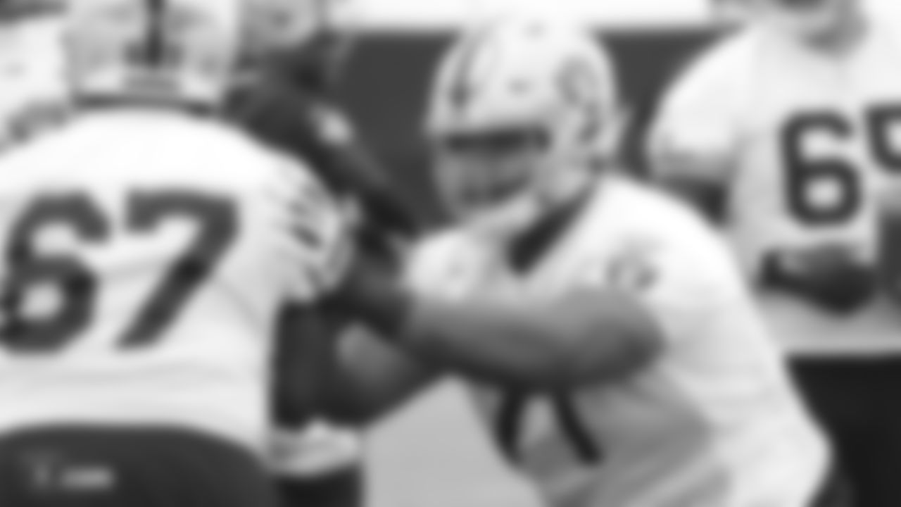 Raiders tackle Denzelle Good (71) on the field for practice.