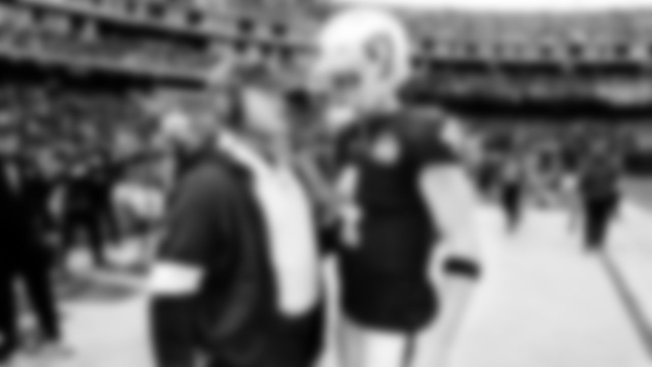 Raiders Head Coach Jon Gruden talks with quarterback Derek Carr (4) during the regular season game against the Jacksonville Jaguars.