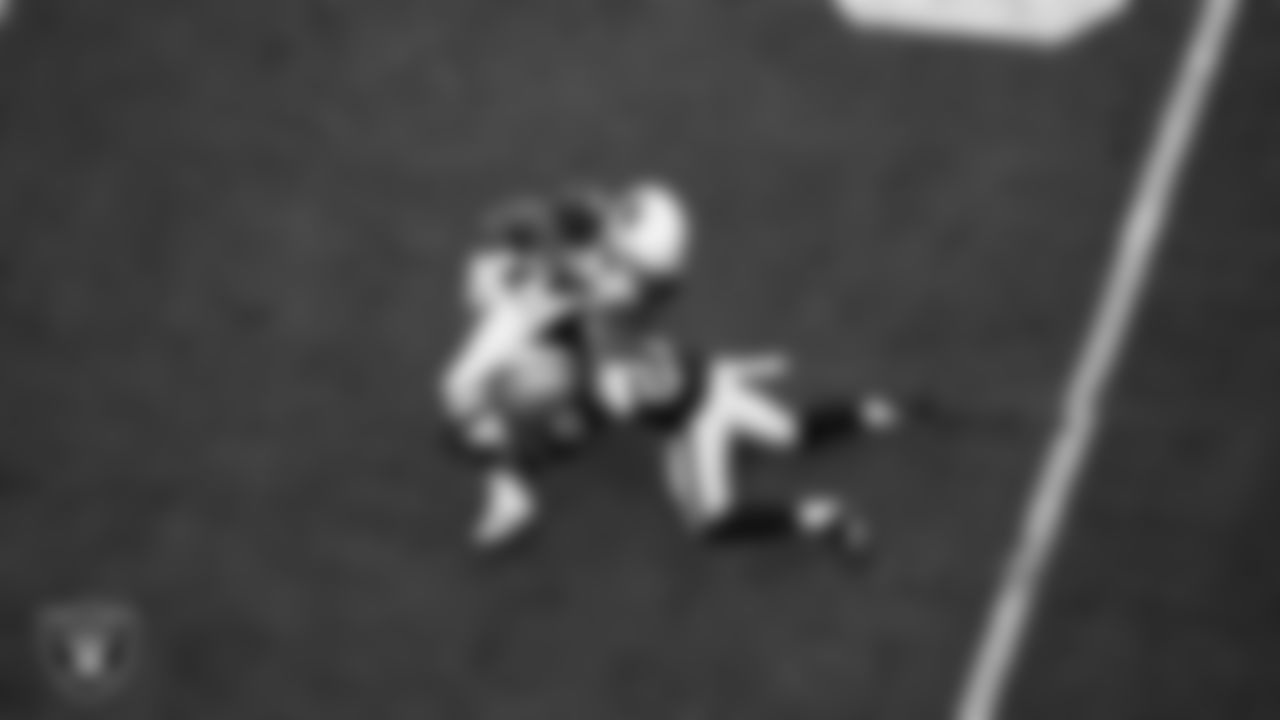 Las Vegas Raiders cornerback Amik Robertson (21) makes a tackle during the regular season home game against the Arizona Cardinals at Allegiant Stadium.