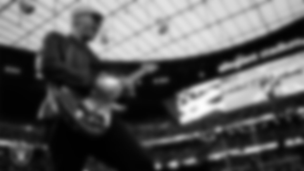Guitarist and songwriter Joe Satriani performs the national anthem before the Las Vegas Raiders' regular season home game against the San Francisco 49ers at Allegiant Stadium.