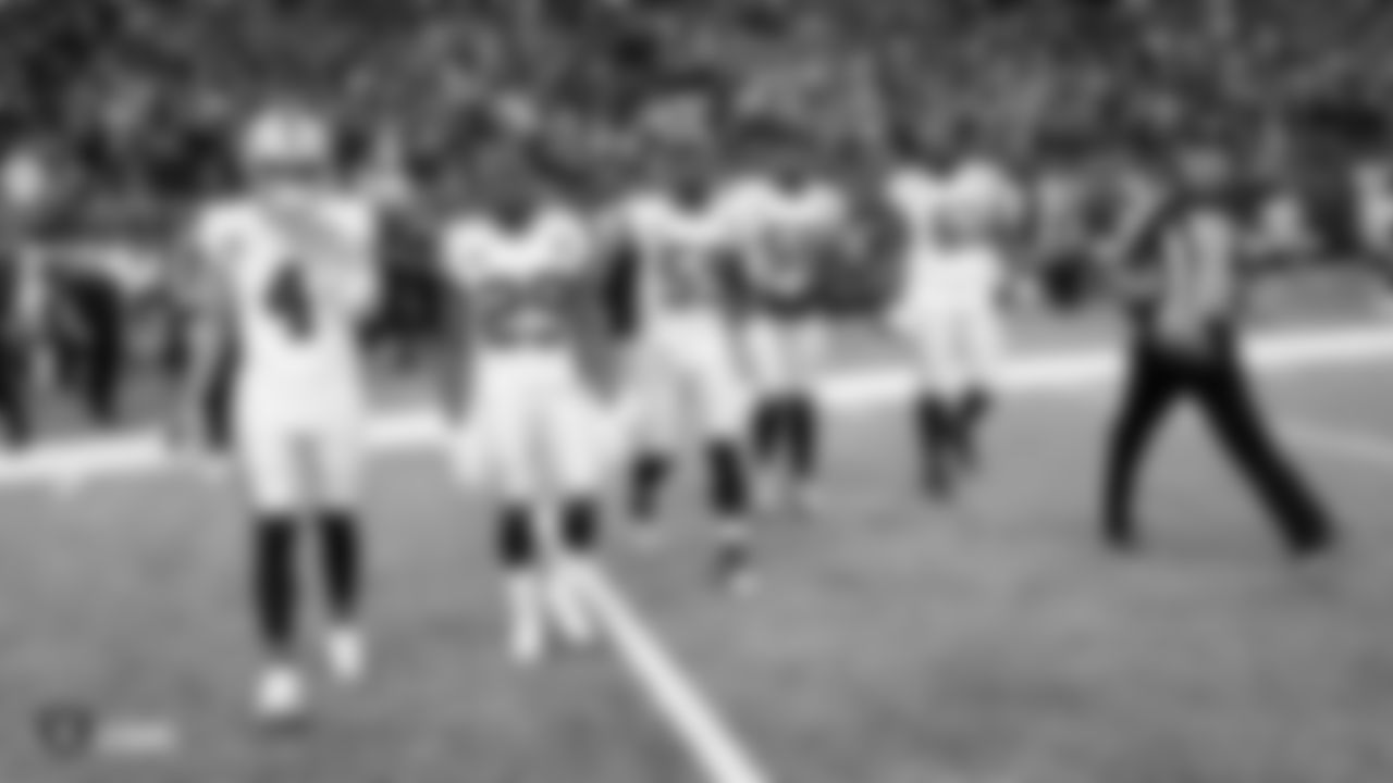 Oakland Raiders quarterback Derek Carr (4), safety Lamarcus Joyner (29), linebacker Tahir Whitehead (59), linebacker Vontaze Burfict (55) and center Rodney Hudson (61) walk out to the center of the field for the coin toss before the Oakland Raiders regular season game against the the Minnesota Vikings at U.S. Bank Stadium.