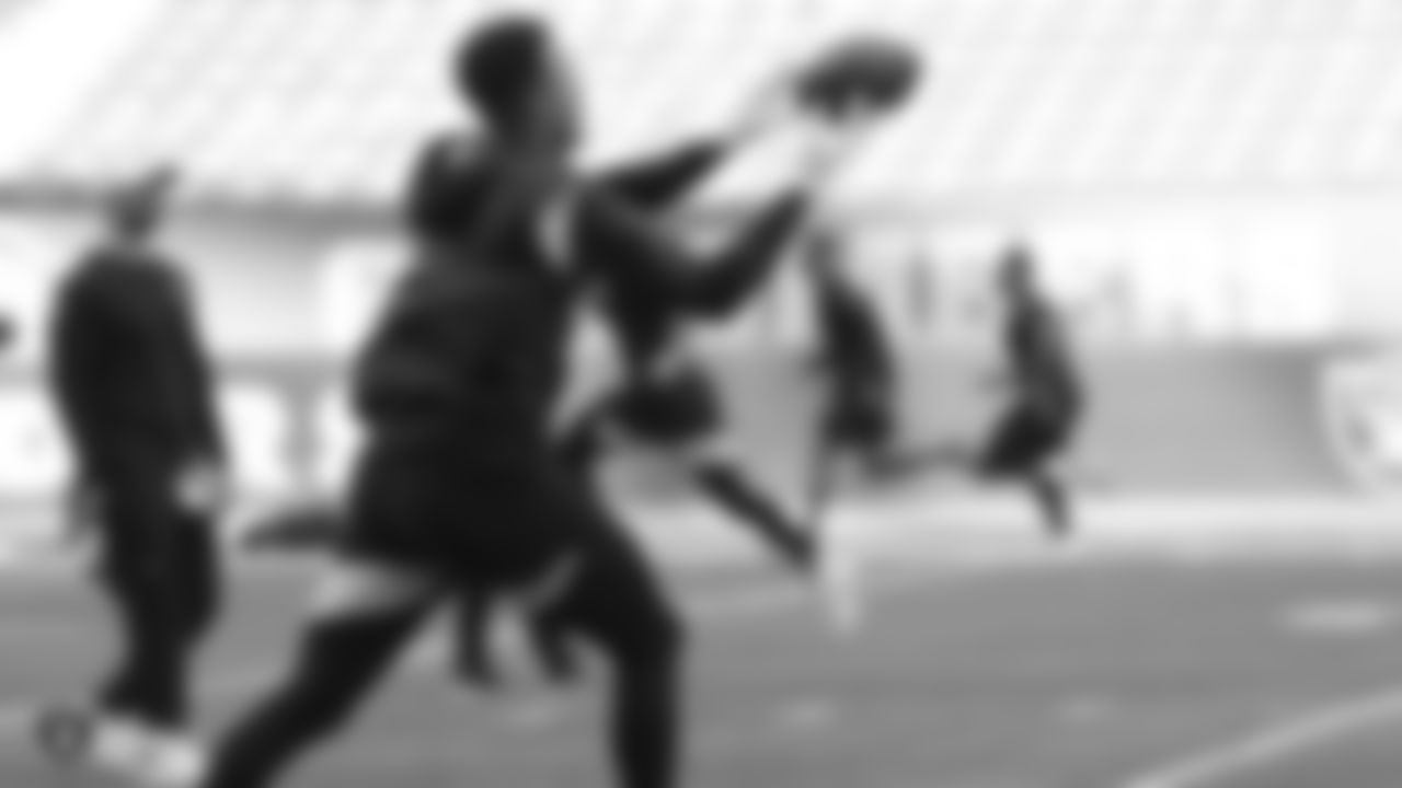 The Raiders warm up before their preseason game against the Green Bay Packers at IG Field.