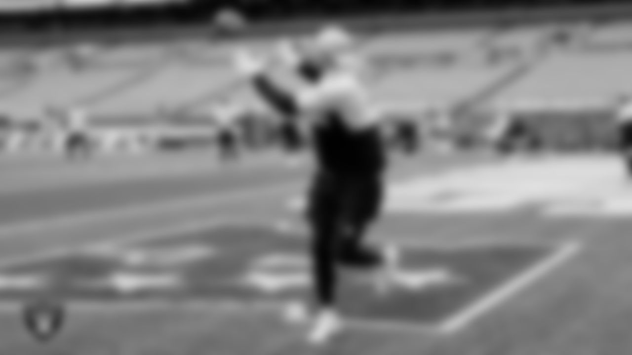 The Raiders warm up before the regular season game against the Cleveland Browns at FirstEnergy Stadium.