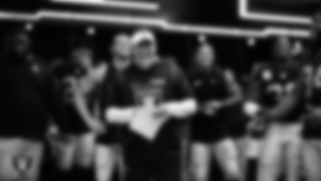 Las Vegas Raiders Head Coach Josh McDaniels celebrates with the team in the locker room after the regular season home game against the Los Angeles Chargers at Allegiant Stadium.