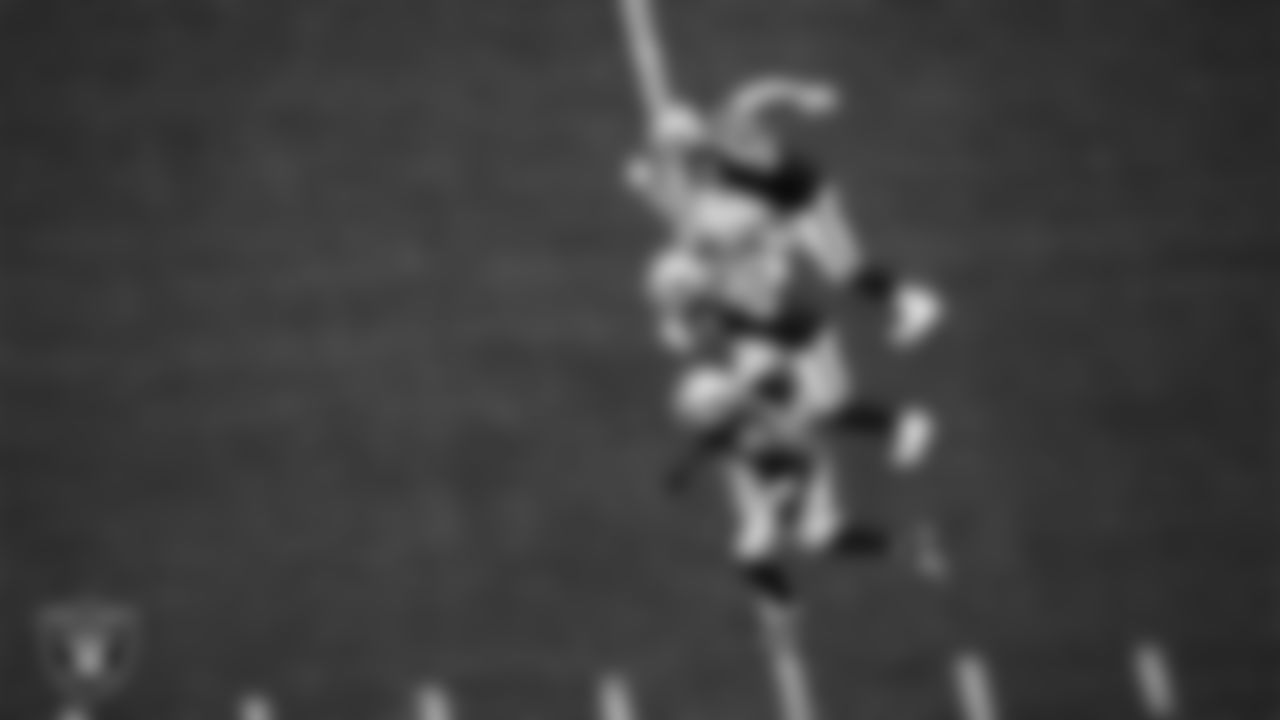 Las Vegas Raiders linebacker Luke Masterson (59), safety Isaiah Pola-Mao (20) and defensive end Clelin Ferrell (99) head down field after a kickoff during the regular season home game against the Arizona Cardinals at Allegiant Stadium.