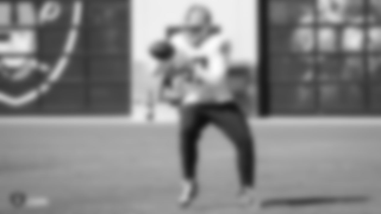 Raiders tight end Foster Moreau (87) goes for a catch during practice.