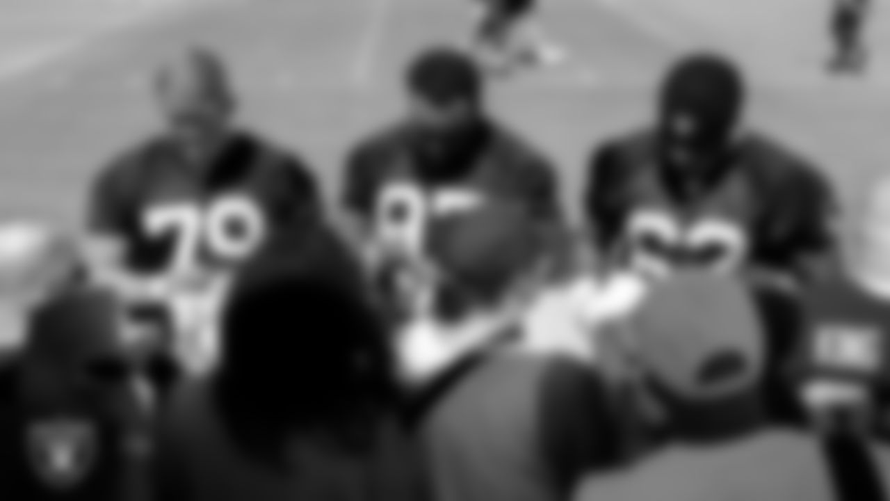 Las Vegas Raiders defensive end George Tarlas (79), defensive tackle Nesta Jade Silvera (97) and defensive lineman David Agoha (62) sign autographs for fans after practice at 2023 Training Camp at Intermountain Health Performance Center.