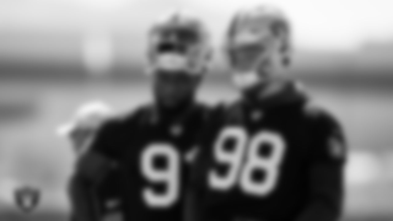 Las Vegas Raiders defensive end Yannick Ngakoue (91) and defensive end Maxx Crosby (98) during practice at Intermountain Healthcare Performance Center.