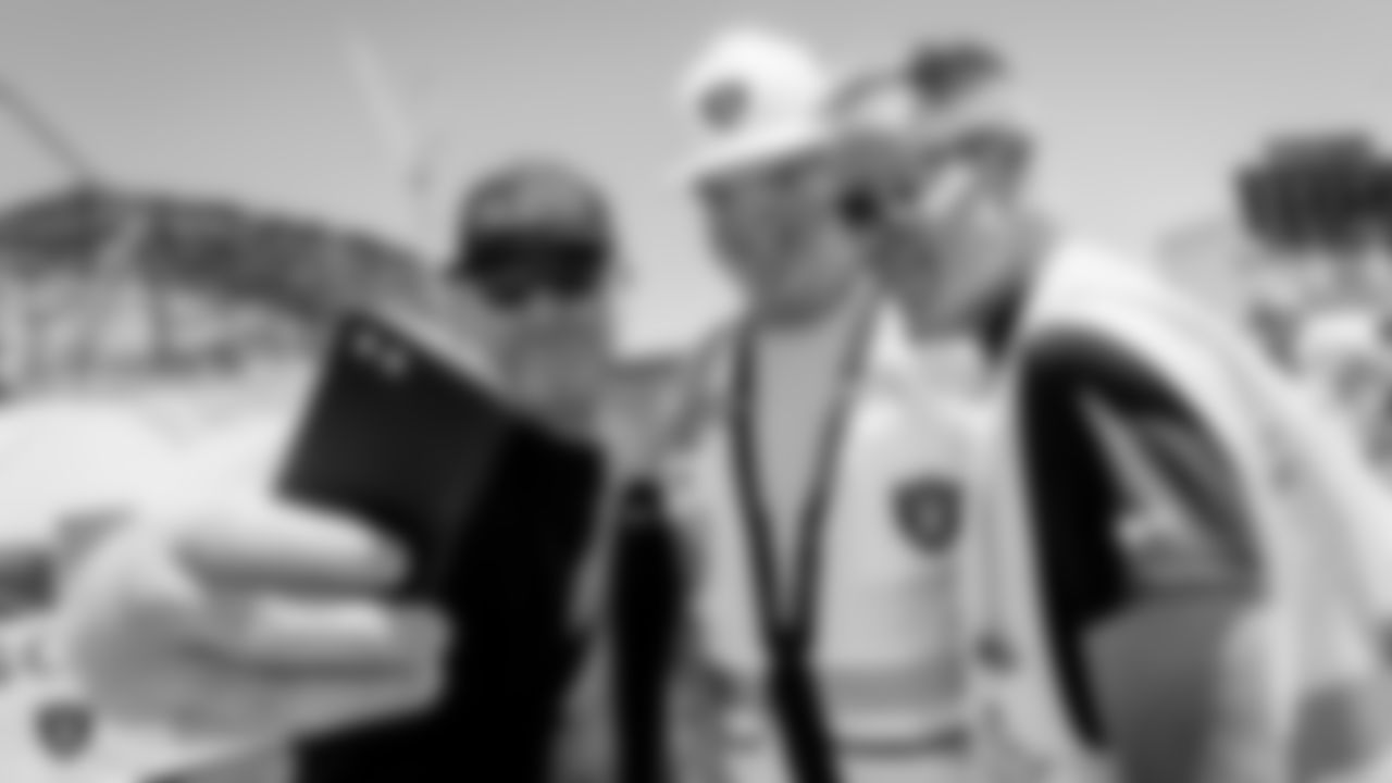 Raiders Owner Mark Davis takes a selfie with construction workers during a special lunch for construction workers of the Allegiant Stadium worksite.