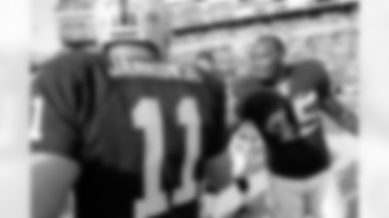 K Sebastian Janikowski is congratulated by FB Marcel Reece.