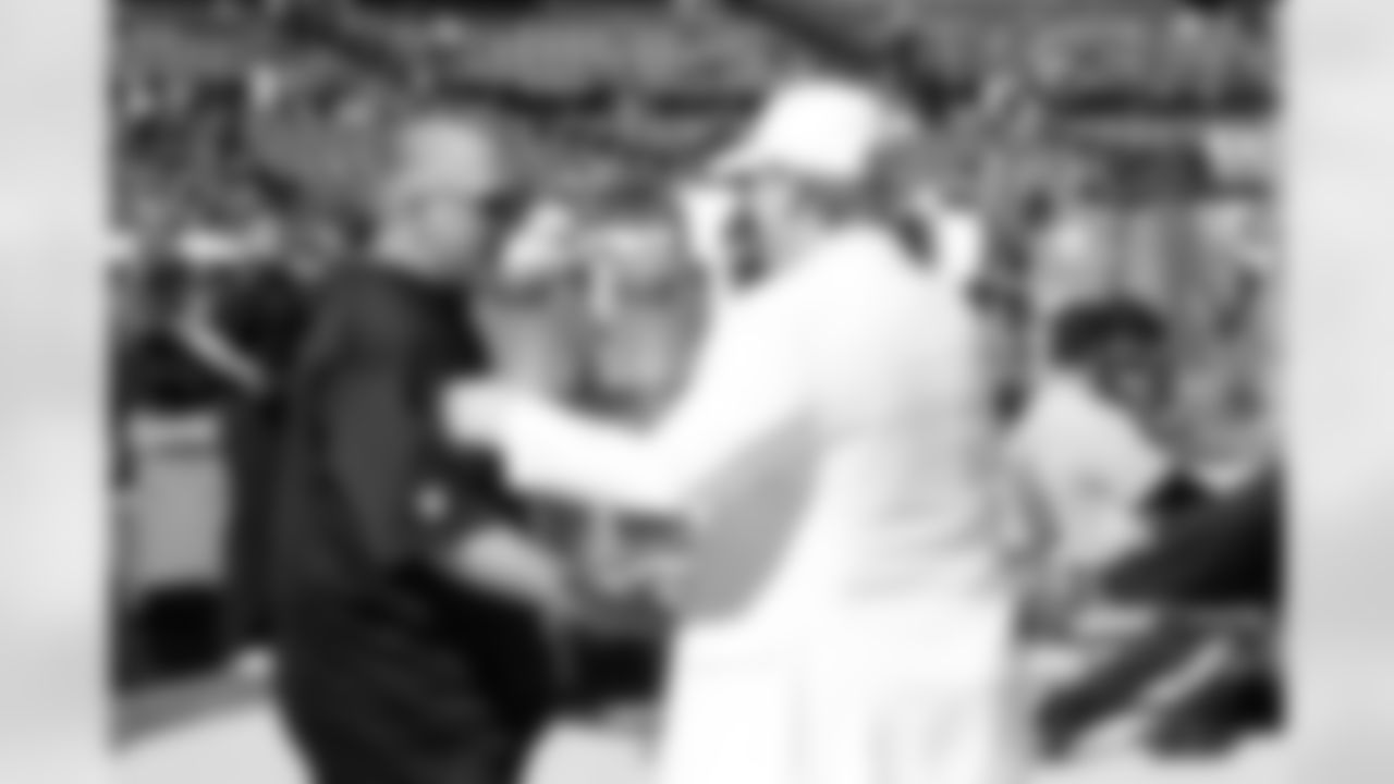 Owner Mark Davis greets Interim Head Coach Tony Sparano