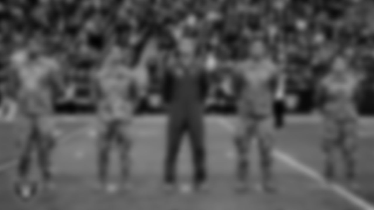 Members of the United States Air Force take part in a reenlistment ceremony before the Las Vegas Raiders' regular season home game against the Indianapolis Colts at Allegiant Stadium.