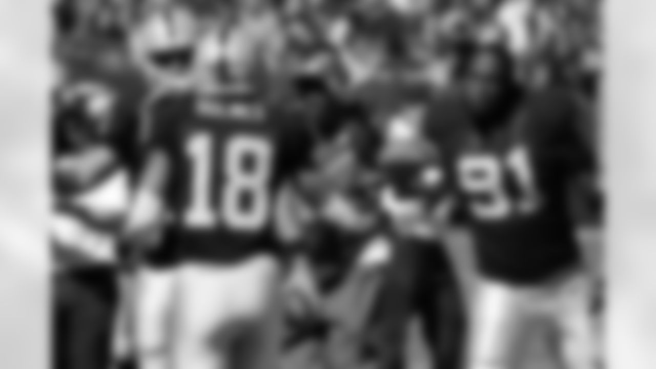 DE Justin Tuck congratulates WR Andre Holmes after his touchdown.