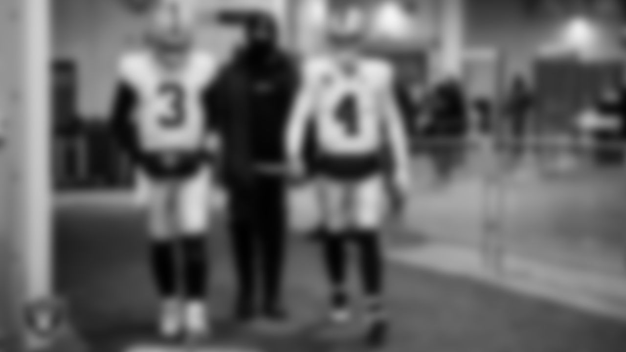 Las Vegas Raiders quarterback Jarrett Stidham (3), quarterback Chase Garbers (15) and quarterback Derek Carr (4) walk down the tunnel before the regular season away game against the Pittsburgh Steelers at Acrisure Stadium.