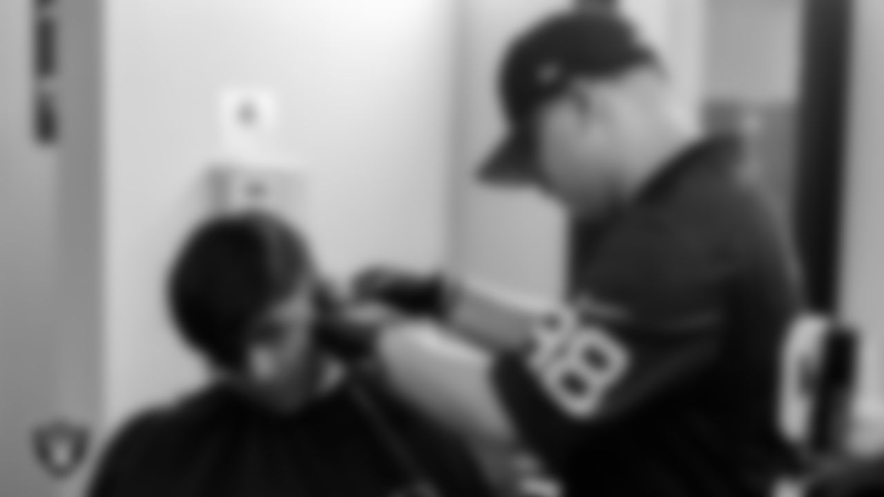 Students receive free haircuts and beautician services for the back to school season courtesy of the Las Vegas Raiders at Expertise Cosmetology Institute.