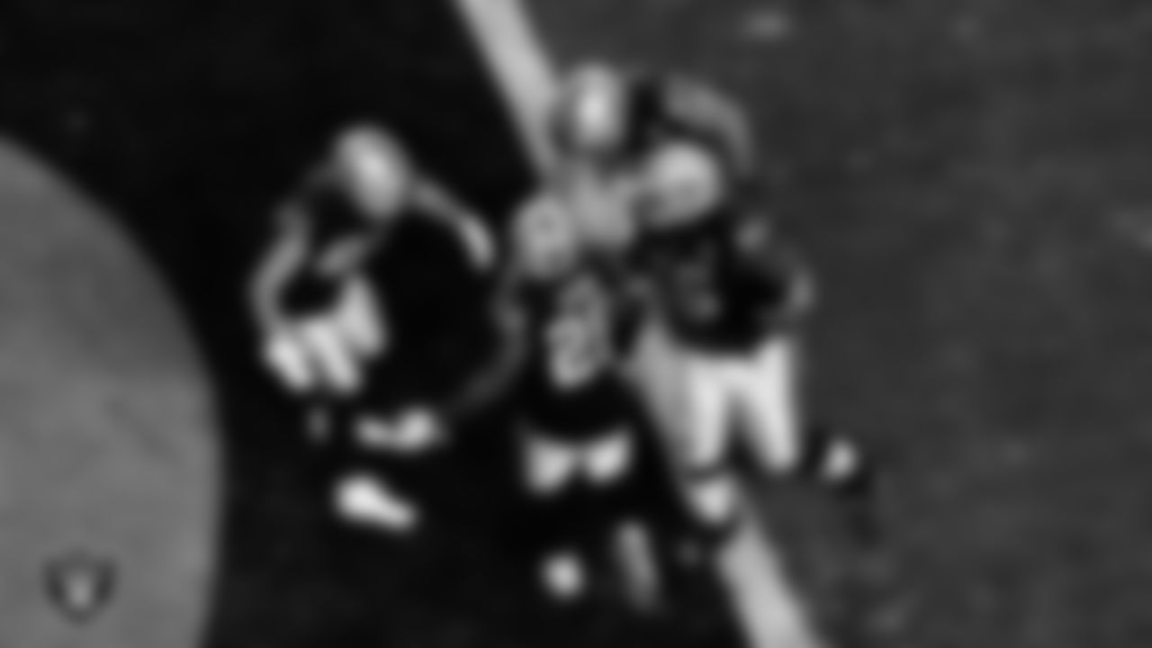 Las Vegas Raiders running back Josh Jacobs (28) celebrates with tight end Derek Carrier (85), tight end Foster Moreau (87) and guard Gabe Jackson (66) after rushing for a 1-yard touchdown during the regular season home game against the Los Angeles Chargers.