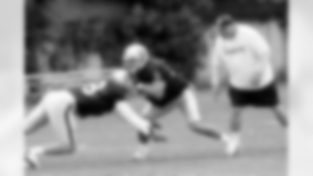 The Raider linebacker fights through the block and tries to make the tackle. Photo By Tony Gonzales