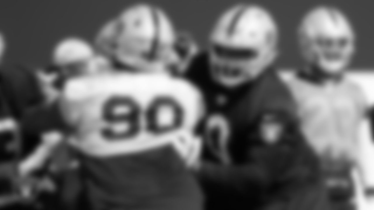 Las Vegas Raiders defensive tackle Johnathan Hankins (90) and guard Jordan Simmons (60) during practice at Intermountain Healthcare Performance Center.