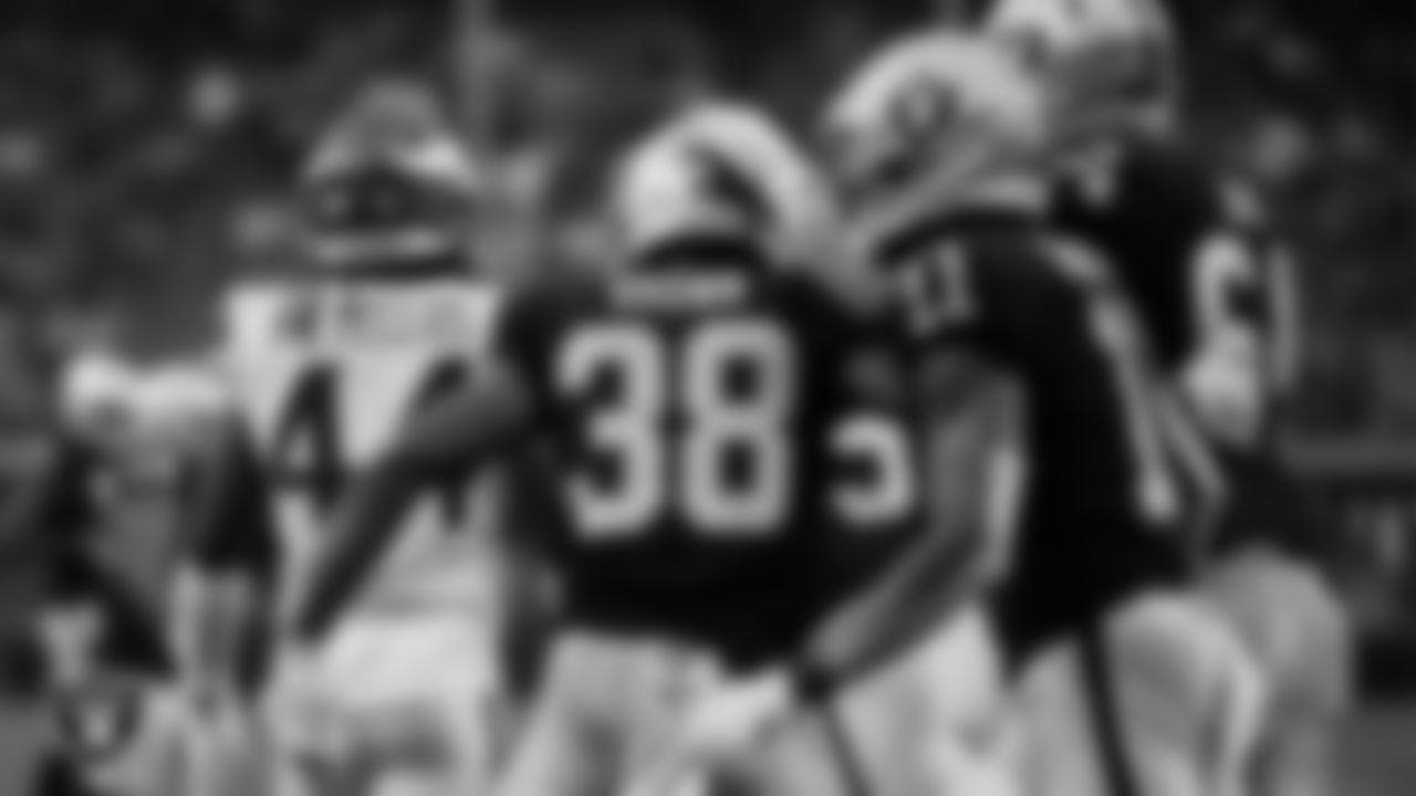 Las Vegas Raiders running back Brittain Brown (38) celebrates after rushing for a 1-yard touchdown with offensive lineman Alex Bars (64) during the preseason home game against the Minnesota Vikings at Allegiant Stadium.