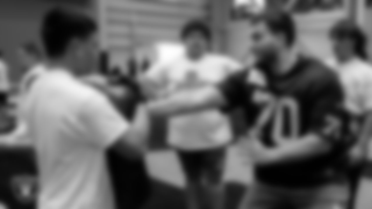 Las Vegas Raiders tackle Sebastian Gutierrez (70) works on a drill with athletes during the ELITE Academy at Las Vegas Raiders Headquarters.