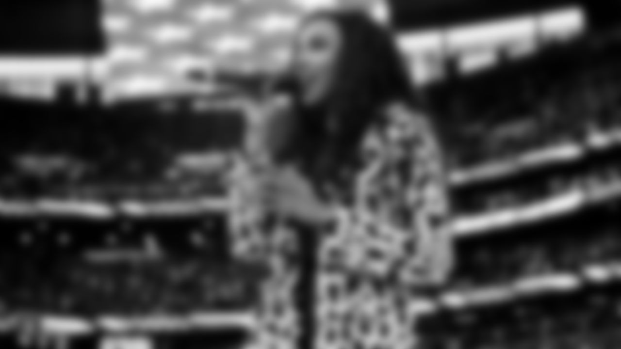 Singer Tinashe performs the national anthem before the Raiders regular season game against the Chicago Bears.