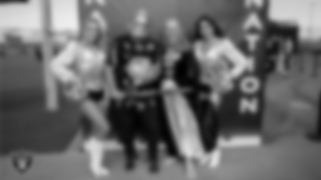 Raiderettes Kennedy and Meekela pose for a photo with fans before practice at 2023 Training Camp at Intermountain Health Performance Center.