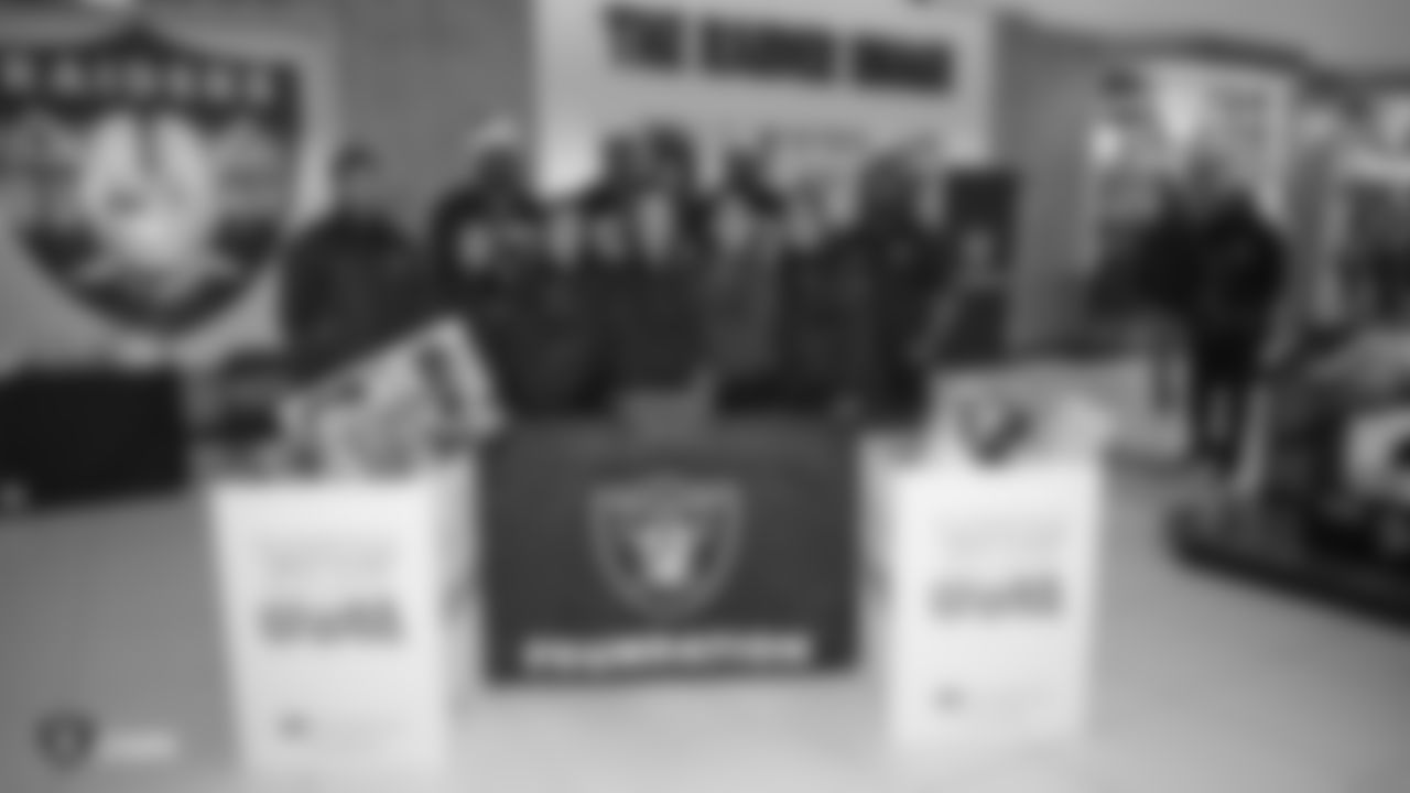 The Raiders Foundation hosts a Toys for Tots drive where guests have the chance to meet Oakland Raiders linebacker Jason Cabinda (53), linebacker Marquel Lee (55), and defensive tackle Maurice Hurst (73) in exchange for a toy or $20 donation to the charity, Tuesday, December 4, 2018, in Hayward, California.