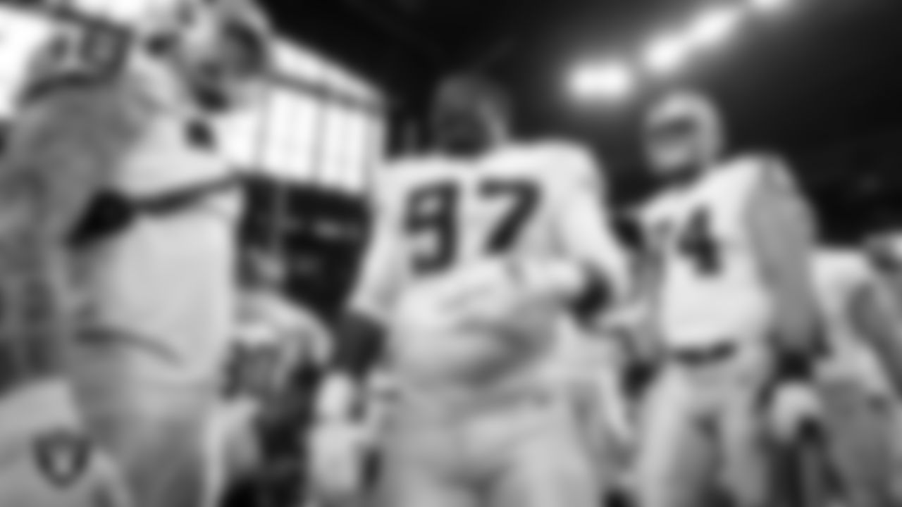 Las Vegas Raiders defensive tackle Damion Square (97) fires the team up in a huddle during warm ups before the regular season away game against the Indianapolis Colts.