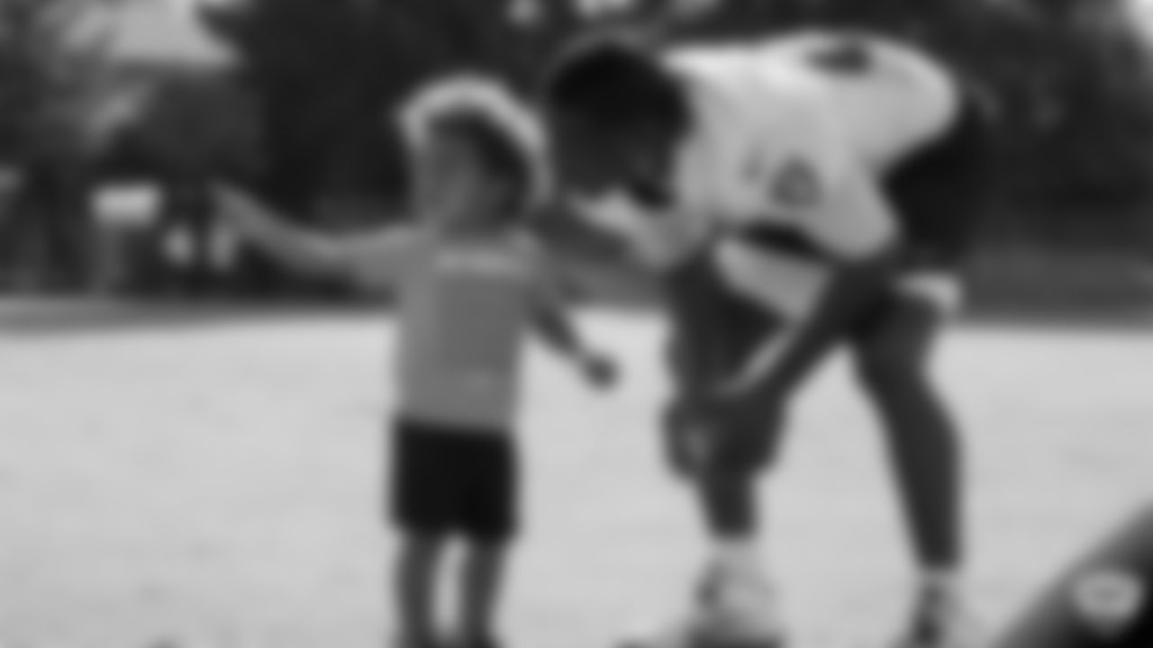 Oakland Raiders wide receiver Antonio Brown (84) and his son on the field for practice at 2019 Training Camp.