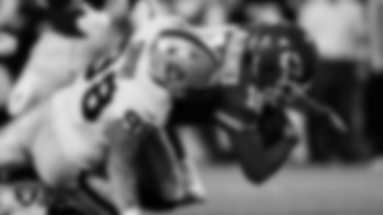 Las Vegas Raiders defensive end Maxx Crosby (98) sacks the quarterback during the regular season away game against the Kansas City Chiefs at GEHA Field at Arrowhead Stadium.