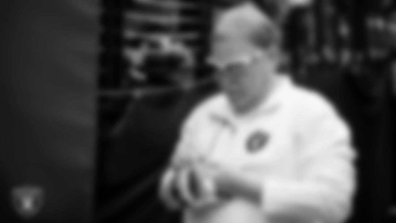Las Vegas Raiders Owner Mark Davis signs autographs for fans before the regular season home game against the Miami Dolphins .