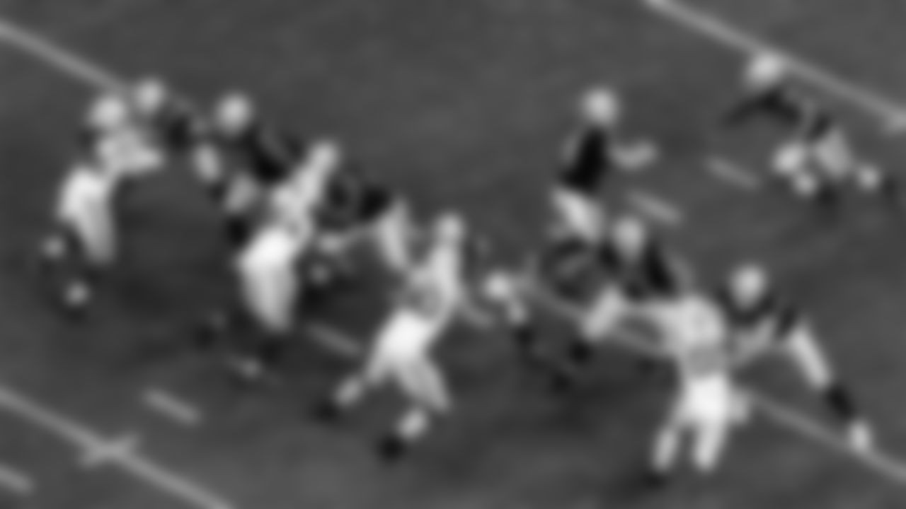 Las Vegas Raiders tight end Darren Waller (83), tackle Trent Brown (77), guard Gabe Jackson (66), center Rodney Hudson (61), tackle Denzelle Good (71) and tackle Kolton Miller (74) block as quarterback Derek Carr (4) hands the ball off to running back Josh Jacobs (28) during the regular season home game against the Indianapolis Colts.