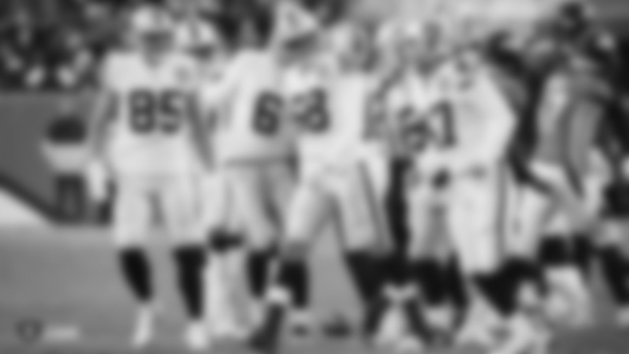 The Raiders during the regular season game against the Denver Broncos at Empower Field at Mile High.