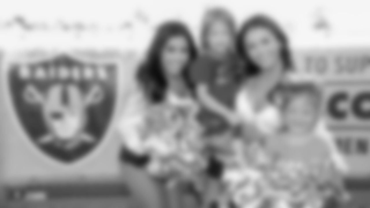 Oakland Raiders alumni and the Raiderettes visit Foothill High School to celebrate the kickoff of the Clark County School District high school 2018 football season, Friday, August 31, 2018, in Henderson, Nev.