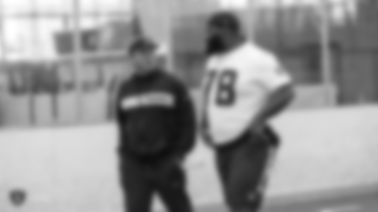 Oakland Raiders head coach Jon Gruden and defensive tackle Justin Ellis (78) on the field for a walk through at Bladium Sports & Fitness Club, Thursday, November 29, 2018, in Alameda, California.