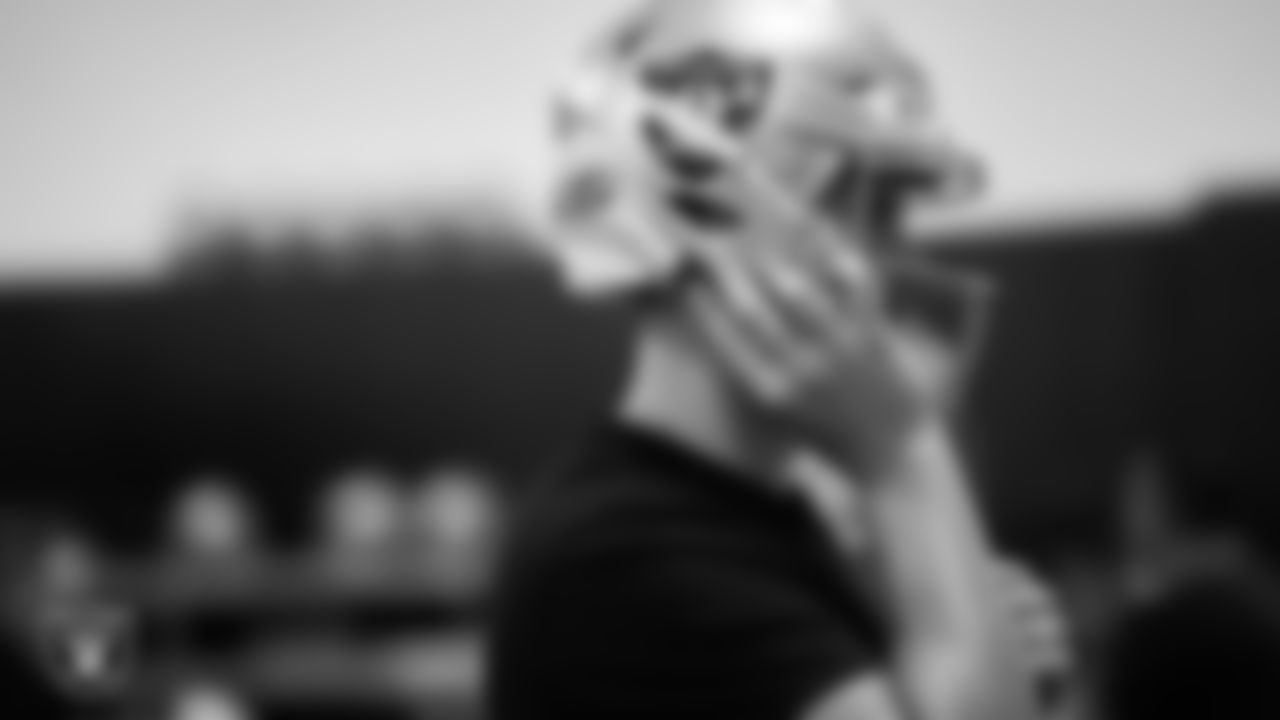 Las Vegas Raiders quarterback Aidan O'Connell tries on his helmet in the equipment room at Intermountain Health Performance Center before the start of the 2023 season Rookie Minicamp.