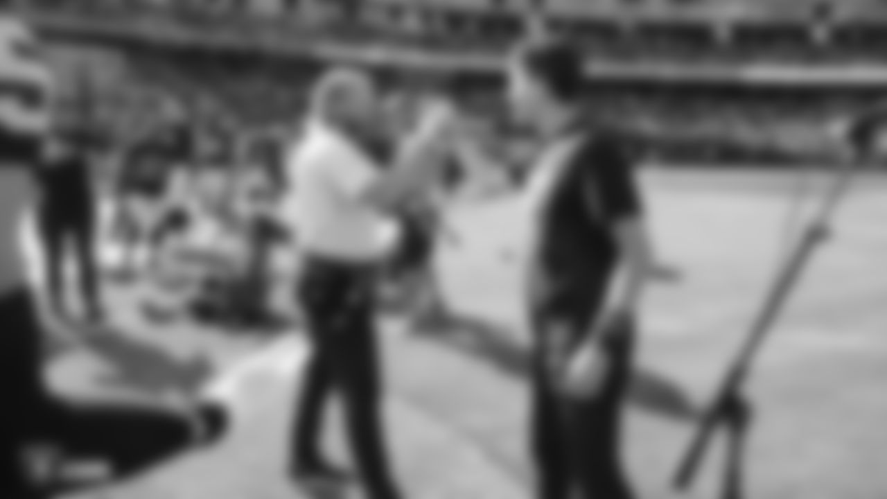 Grandson of Raiders alumnus Tom Flores, Brian Flores, with Head Coach Jon Gruden after performing the national anthem before the Raiders preseason game against the Los Angeles Rams.