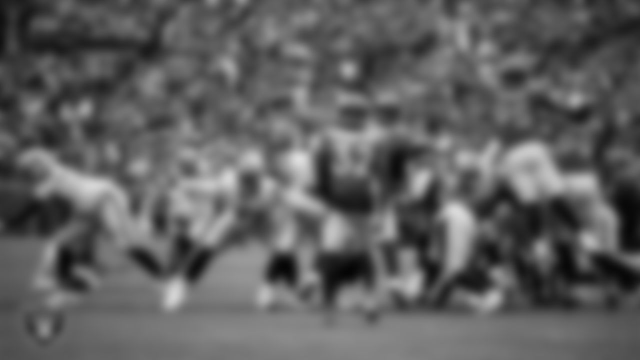 Las Vegas Raiders kicker Daniel Carlson (2) kicks a PAT during the regular season away game against the Denver Broncos at Empower Field at Mile High.