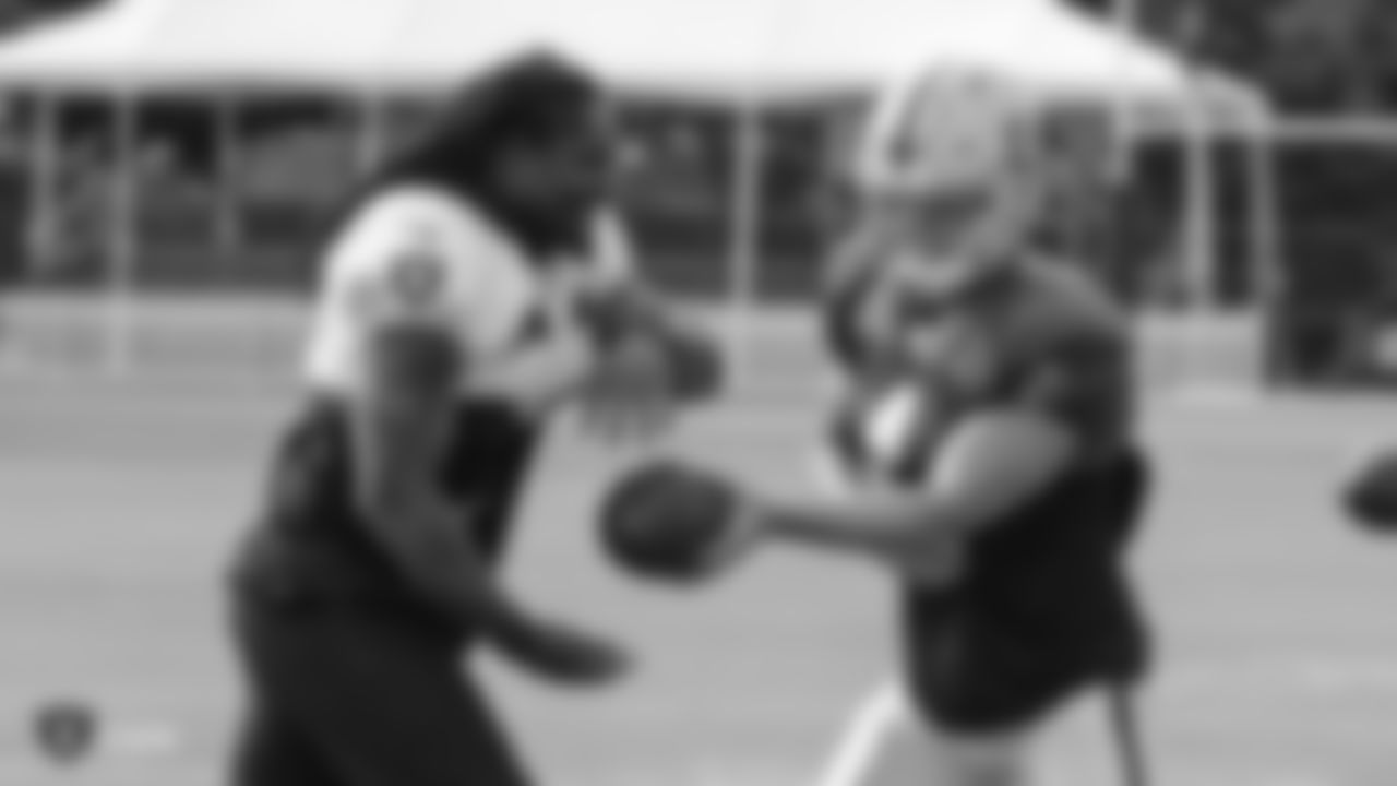 Oakland Raiders running back Marshawn Lynch (24) and quarterback Derek Carr (4) on the field for practice at 2018 Training Camp at The Oakland Raiders Napa Valley Training Complex, Wednesday, August 1, 2018, in Napa, California.