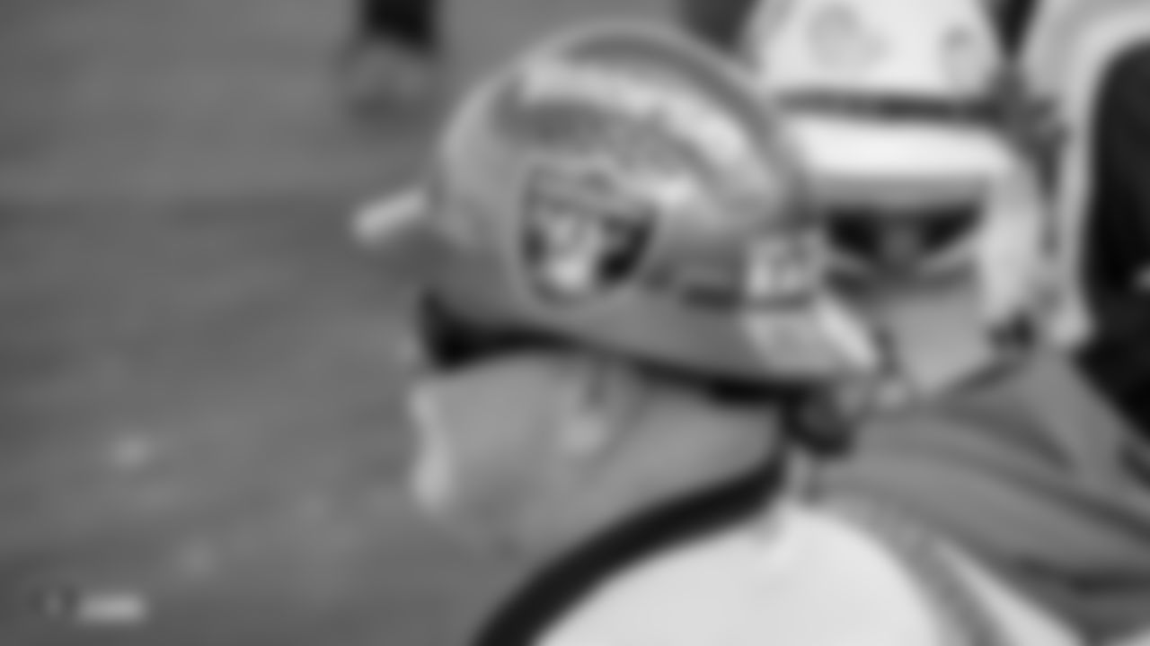 A construction worker wears a Las Vegas Raiders hard hat during an official announcement of the Raiders changing their name to the Las Vegas Raiders.